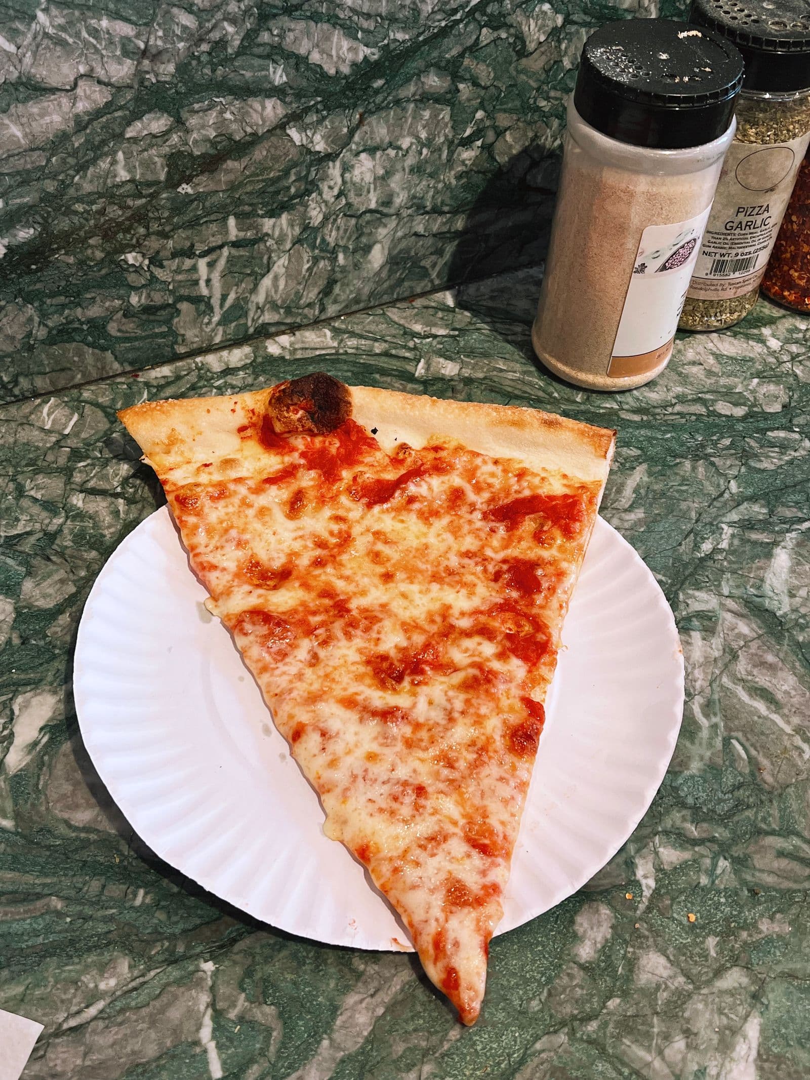 New York style thin crust cheese pizza slice